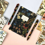 A6 passport-size pocket notebook with a Forest Flowers cover, detail view