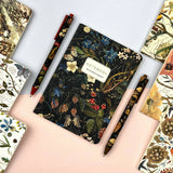 A6 passport-size pocket notebook with a Forest Flowers cover, detail view