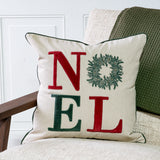 Cream pillow with red and green NOEL lettering and wreath