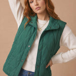 High Neck Snap Button Quilted Puffer Vest in Hunter Green - styled front view