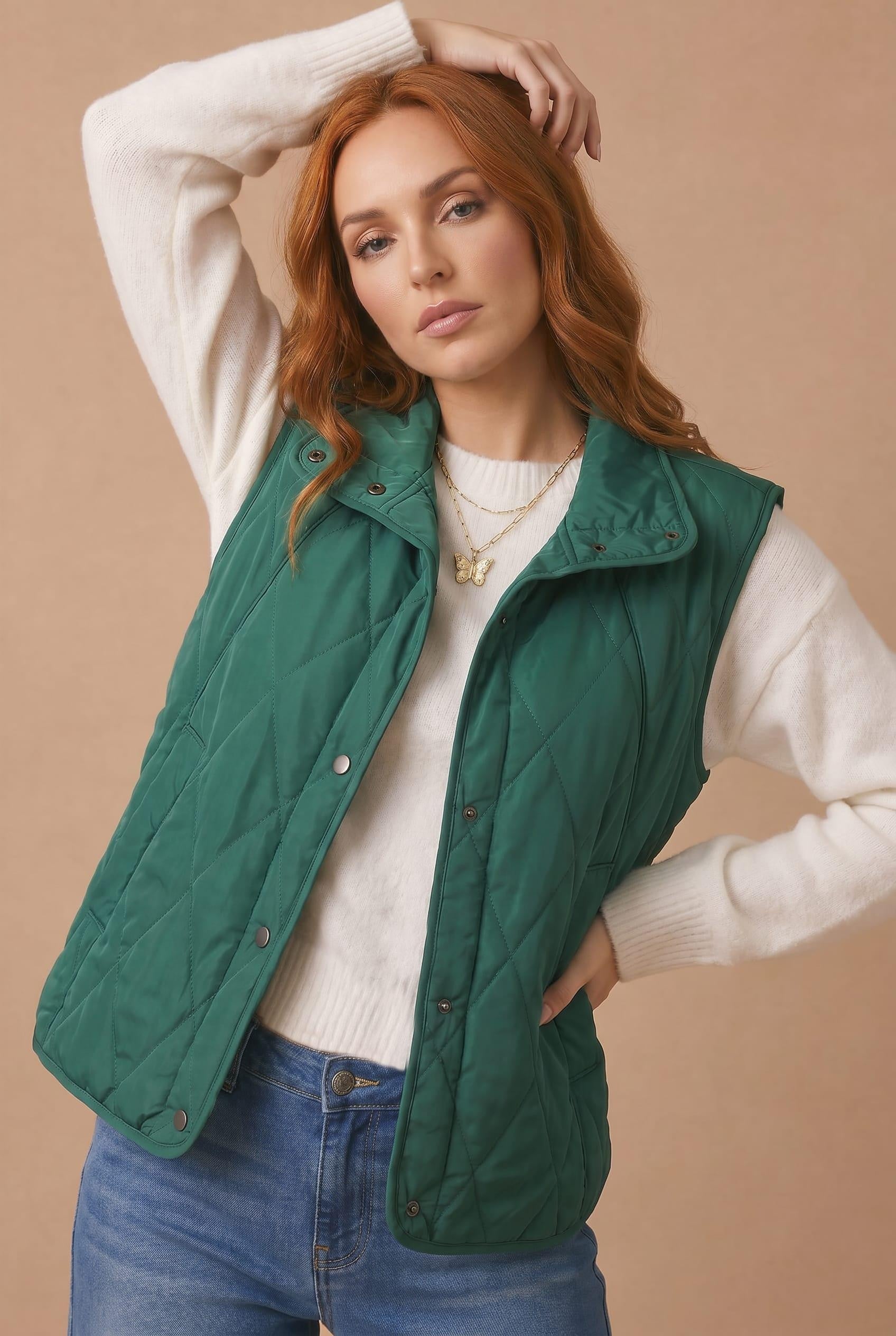 High Neck Snap Button Quilted Puffer Vest in Hunter Green - styled front view