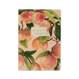 A5 ruled notebook with a painted peach and foliage cover design, front cover