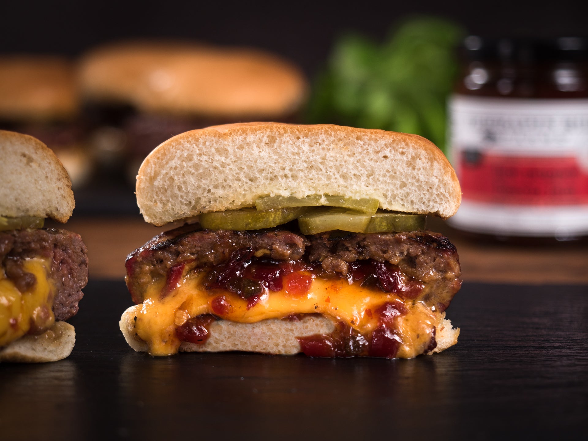 Cheeseburger stuffed with Hot Pepper Bacon Jam, sliced in half