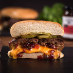Cheeseburger stuffed with Hot Pepper Bacon Jam, sliced in half