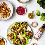 Grilled shrimp lettuce wraps with pineapple, rice and pickled onions