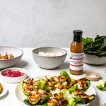 Grilled shrimp skewers on lettuce with rice and Tropical Tequila Sauce
