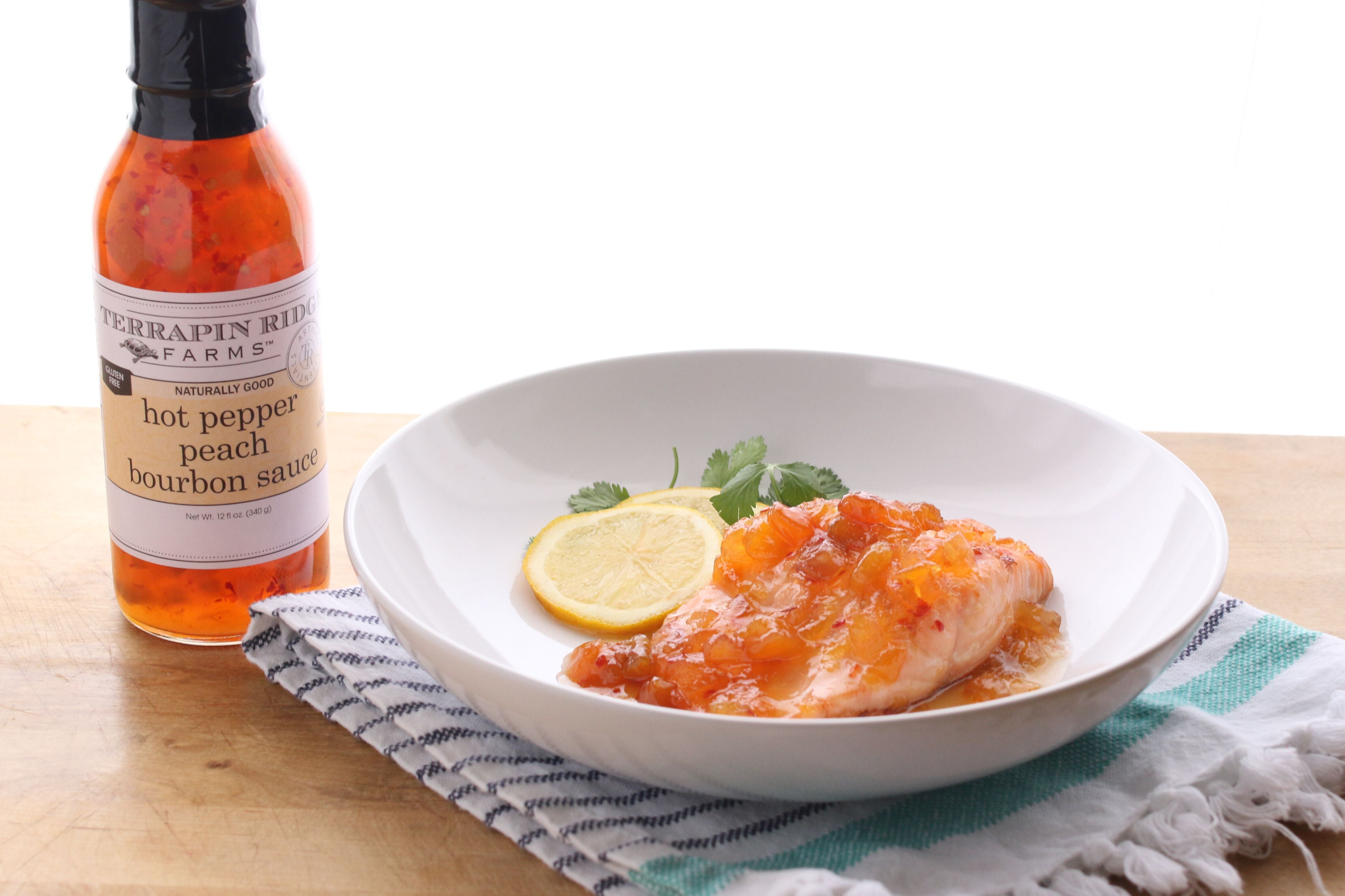 Chicken breast with Hot Pepper Peach Bourbon Sauce, lemon and cilantro