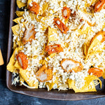 Buffalo chicken nachos with blue cheese crumbles and Buffalo Ranch drizzle