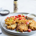 Crispy fritters with green onions and tomatoes served with Bacon Aioli