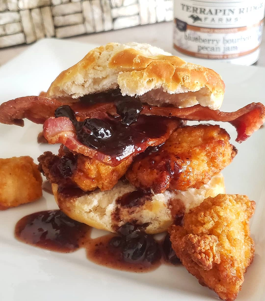 Fried chicken and bacon biscuit sandwich with Blueberry Bourbon Pecan Jam
