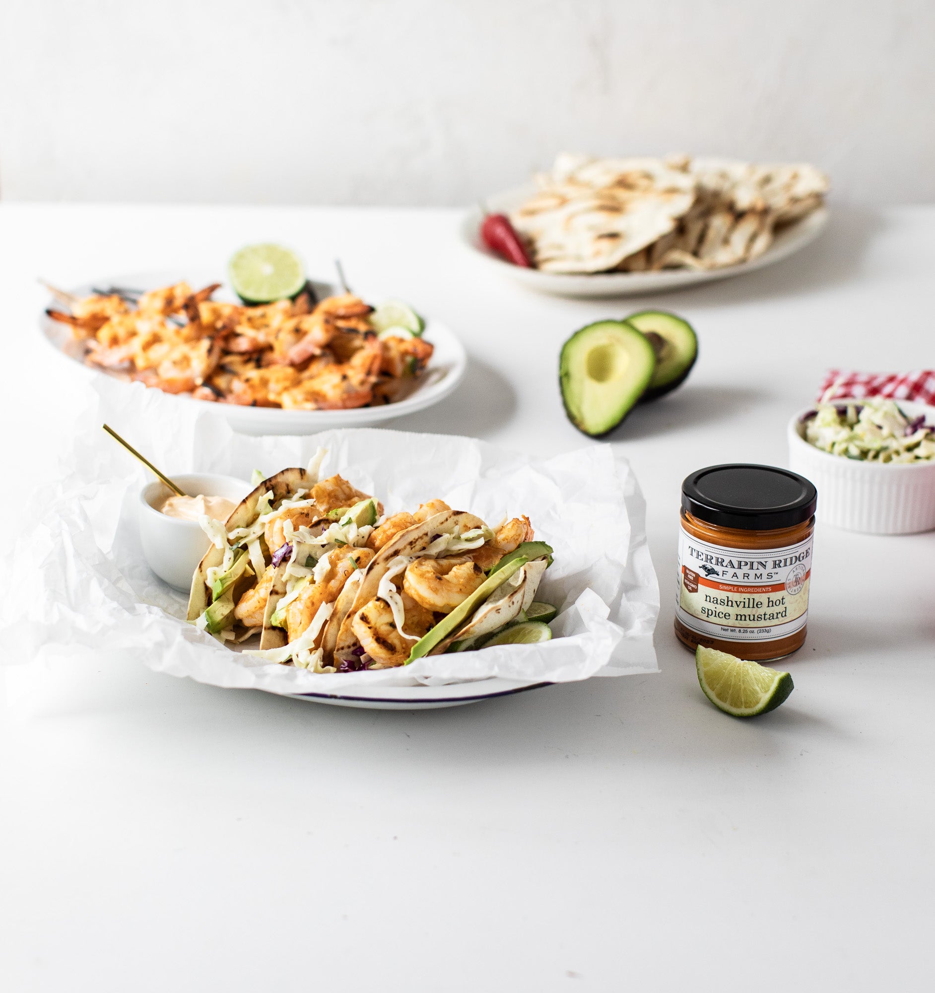 Shrimp tacos with avocado and slaw made with Nashville Hot Mustard