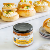 Mini bread bowls filled with pineapple habanero dip