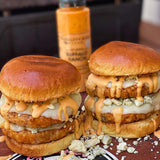 Stacked chicken burgers with melted cheese and Buffalo Ranch sauce