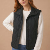 High Neck Snap Button Quilted Puffer Vest in Black - styled front view