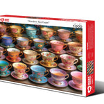 Garden Tea Cups 1,000-piece jigsaw puzzle box showing rows of floral hand-painted porcelain tea cups with gold rims