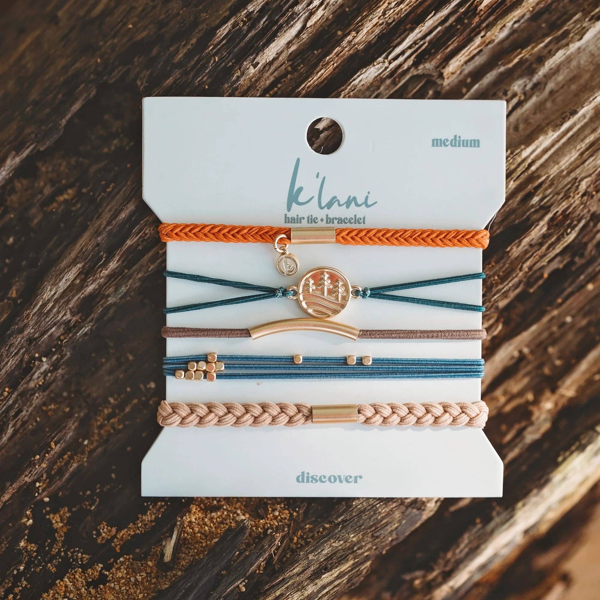 Discover hair tie bracelet set in orange, green, blue and brown with gold pine tree charm, view 6