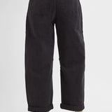 Side view of high rise cropped cargo jeans in black denim