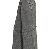 Side view of washed French terry flare pant showing wide leg and raw hem