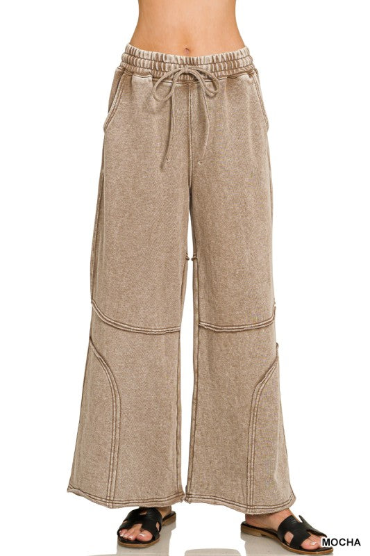 Washed French terry wide-leg flare pant with drawstring waist and exposed seam detail