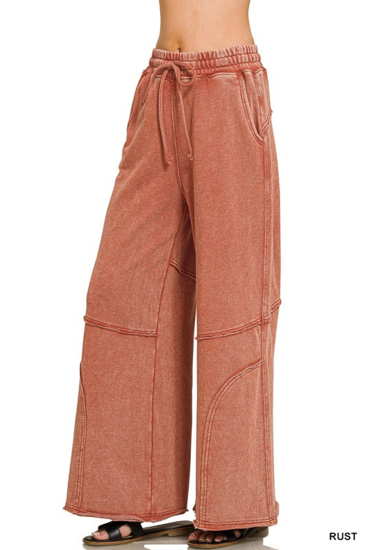 Washed French terry flare pant shown with flat sandals