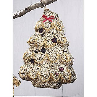 Light seed tree with cranberries and a red bow hanging from a branch
