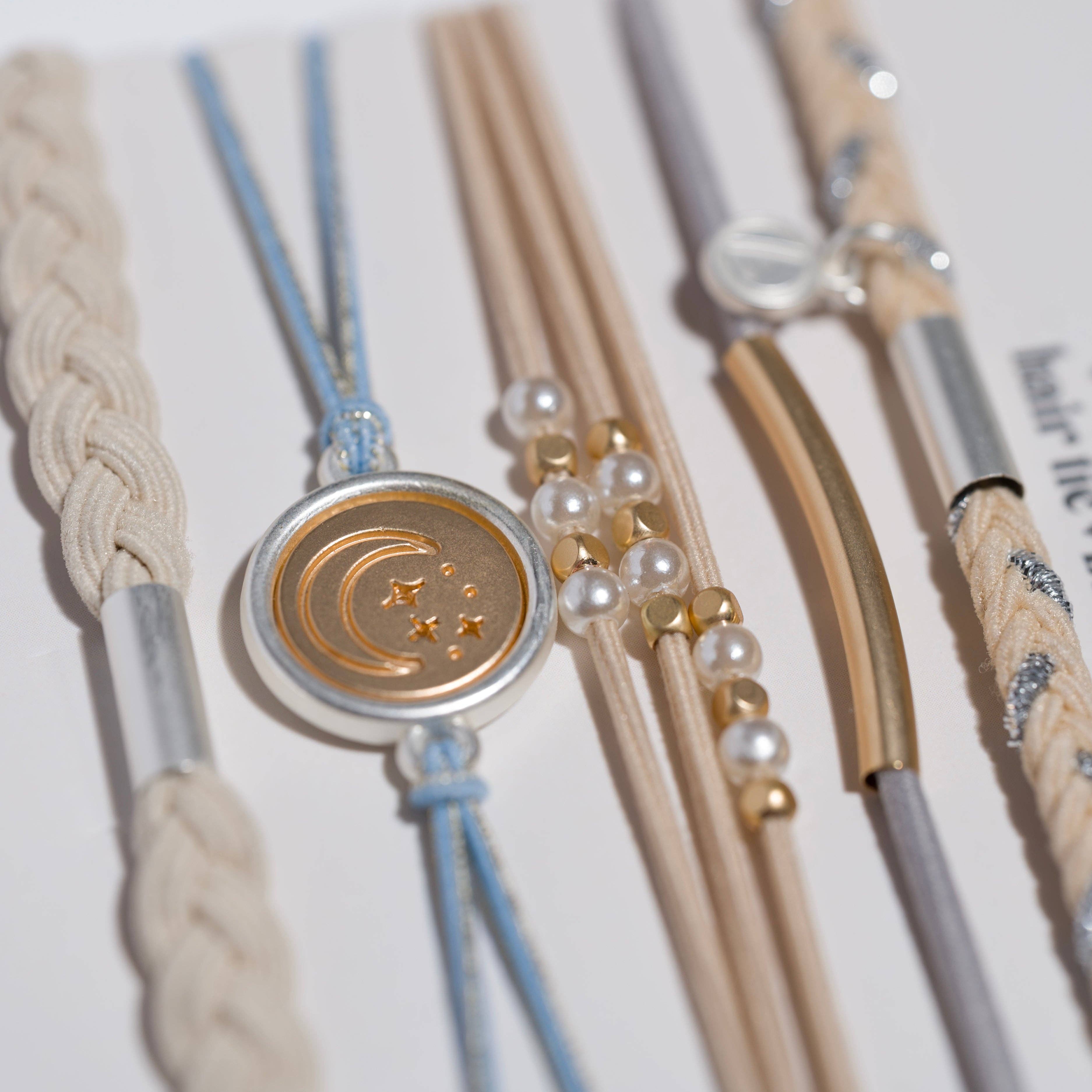 Wonder hair tie bracelet set in cream and blue with pearls and moon and stars charm, view 3