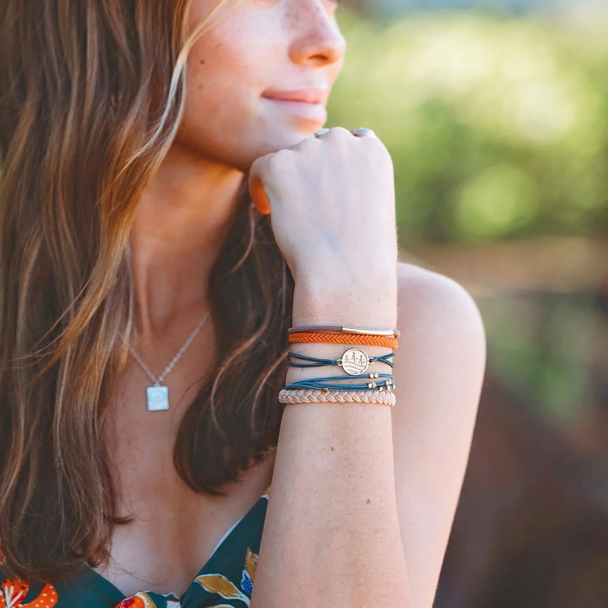 Discover hair tie bracelet set in orange, green, blue and brown with gold pine tree charm, view 4