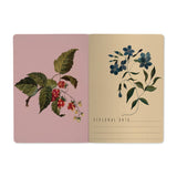A5 notebook with a forest flower design on a white soft-touch cover, detail view