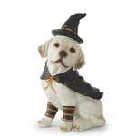 Resin dog figure wearing a witch hat and cape