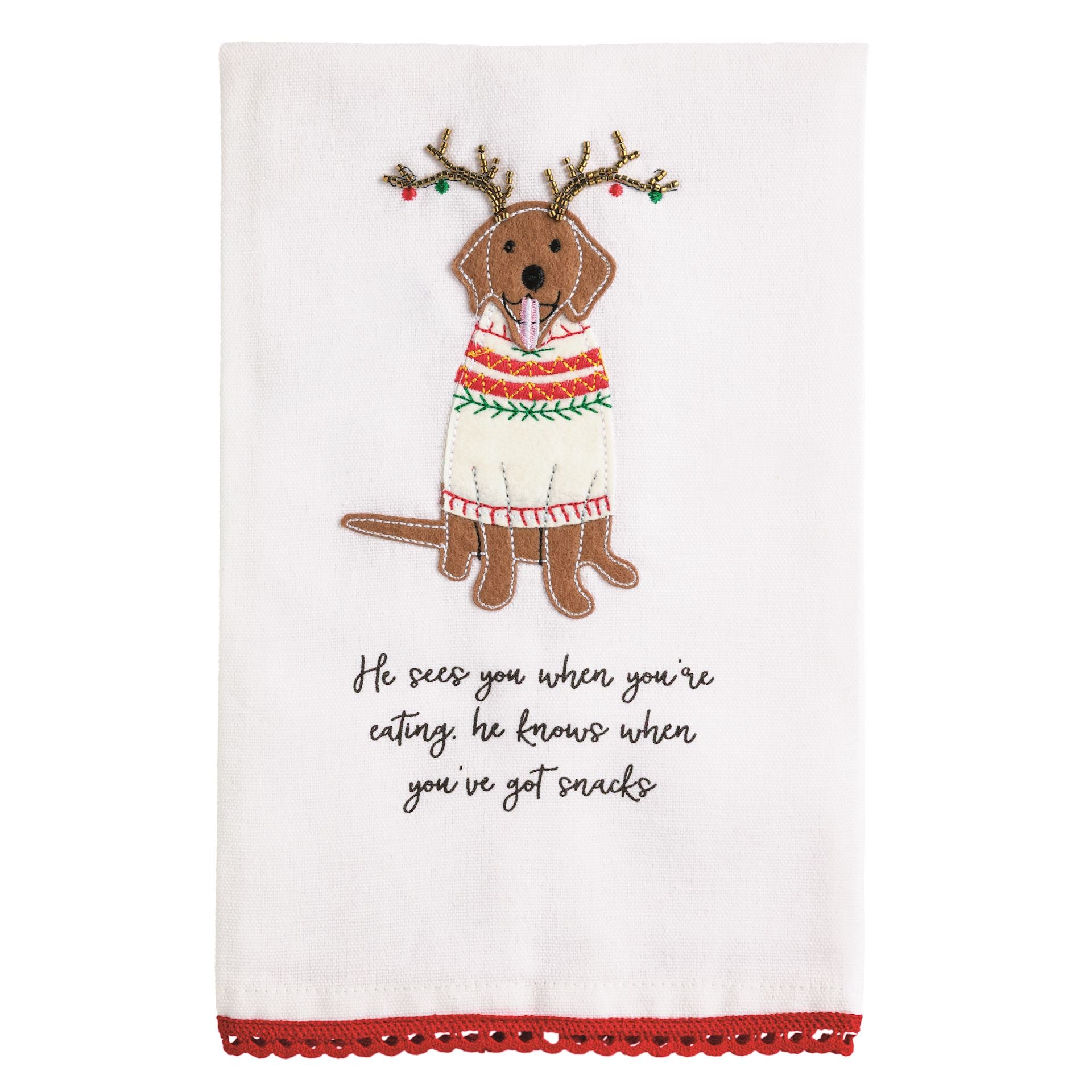 White towel with a felt dog appliqué in reindeer antlers and a sweater above a he sees you poem