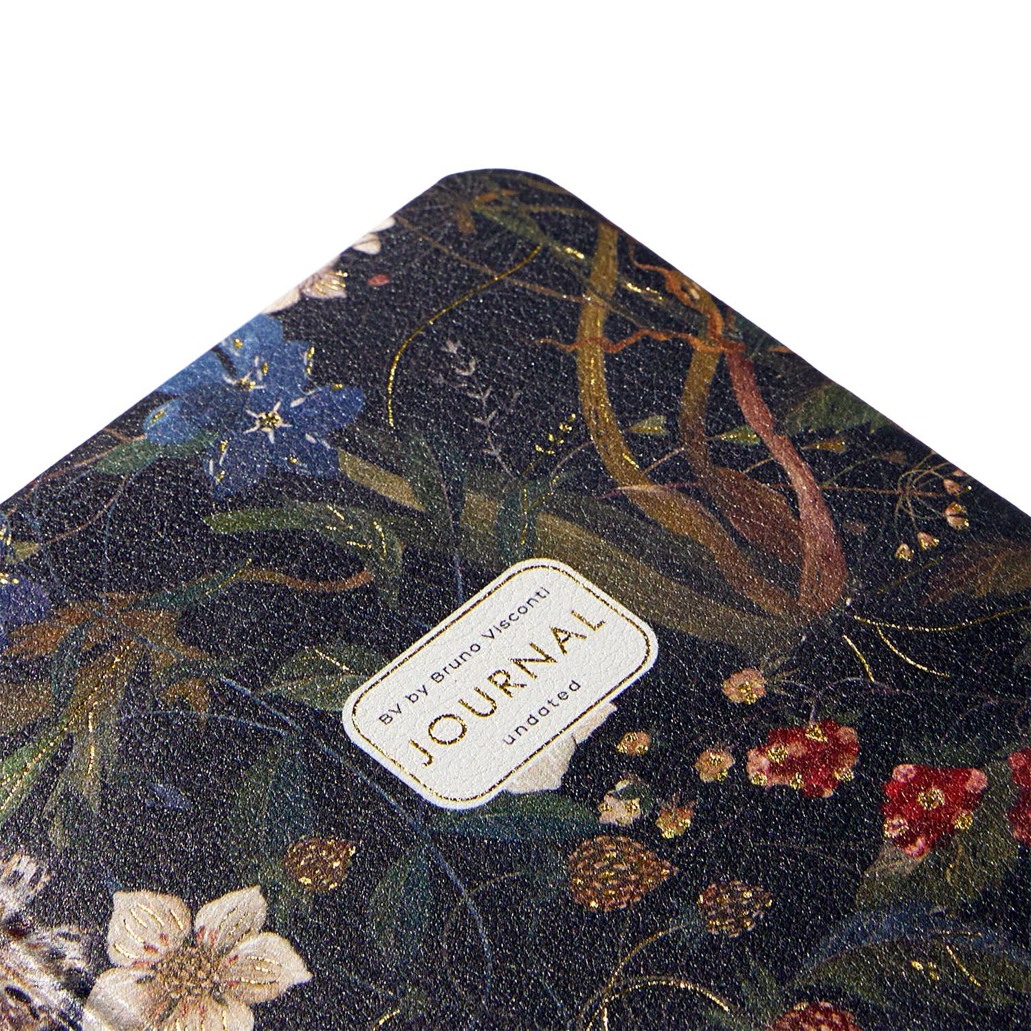 A6 vegan leather daily planner with a Forest Flowers cover and gilded page edges, detail view