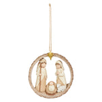 Round natural-tone ring ornament framing a carved Holy Family scene, hung from twine