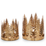 Two antique gold iron hurricanes with cutout tree silhouettes around the rim