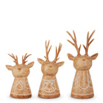 Three light brown carved-look deer busts with antlers and etched folk patterns