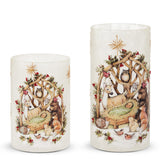 Two frosted glass cylinders painted with a woodland nativity scene and forest animals