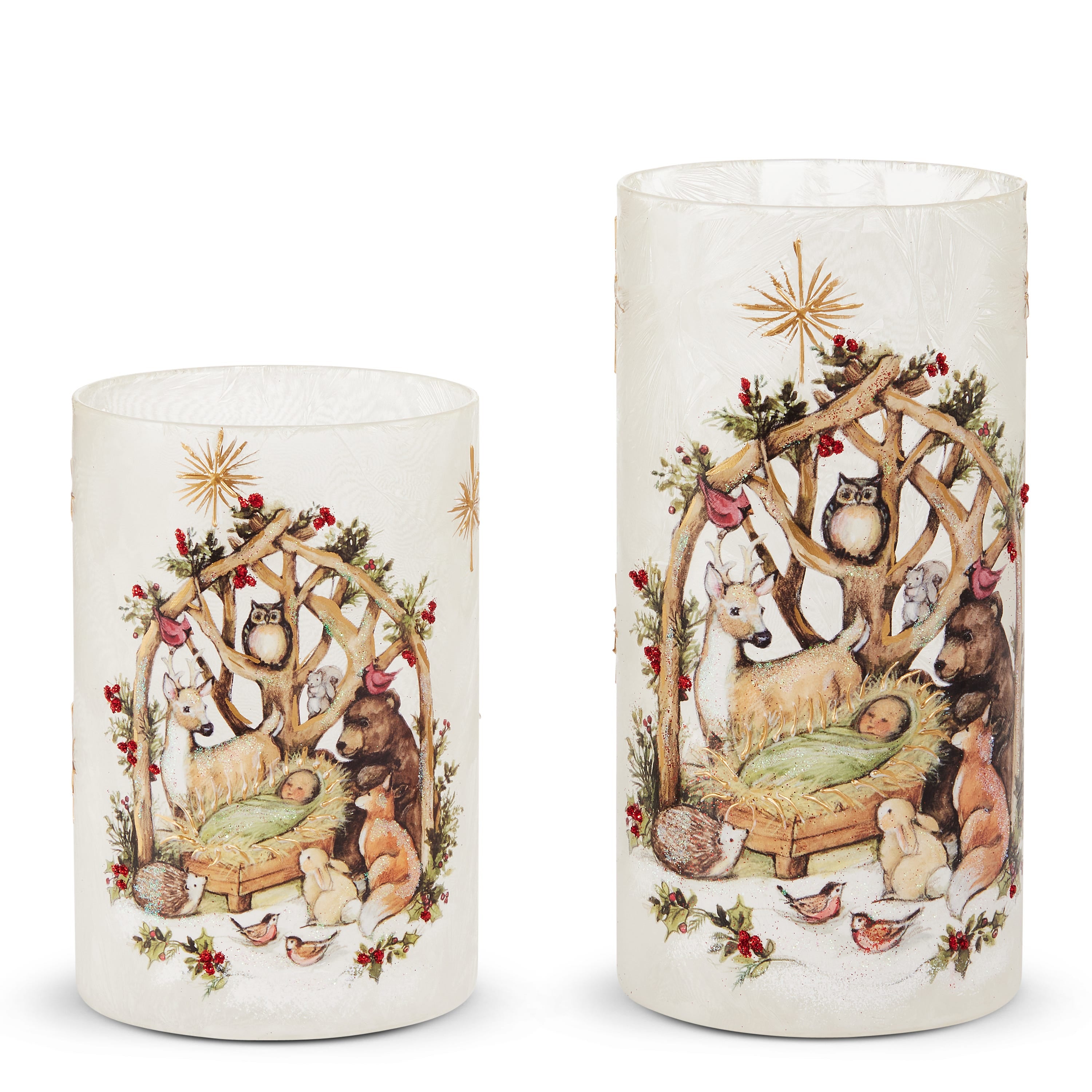 Two frosted glass cylinders painted with a woodland nativity scene and forest animals