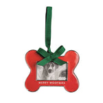 Red bone-shaped photo frame ornament with a green bow and MERRY WOOFMAS lettering