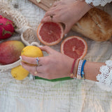 Dolce Vita hair tie bracelet set with floral glass beads and gold heart charm, view 6