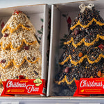 Two boxed seed trees with red Christmas Tree labels, side by side