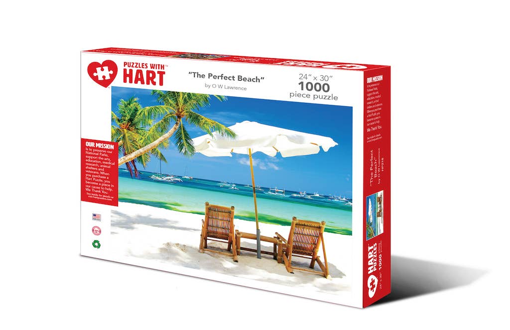The Perfect Beach 1,000-piece jigsaw puzzle box showing two beach chairs under a white umbrella on a tropical beach with turquoise water