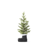 Small snowy pine tree planted in a black Santa boot with a white fur cuff