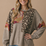 Blouson sleeve cuff detail on the floral patchwork knit top