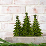 Trio of glossy green wood trees with star tops