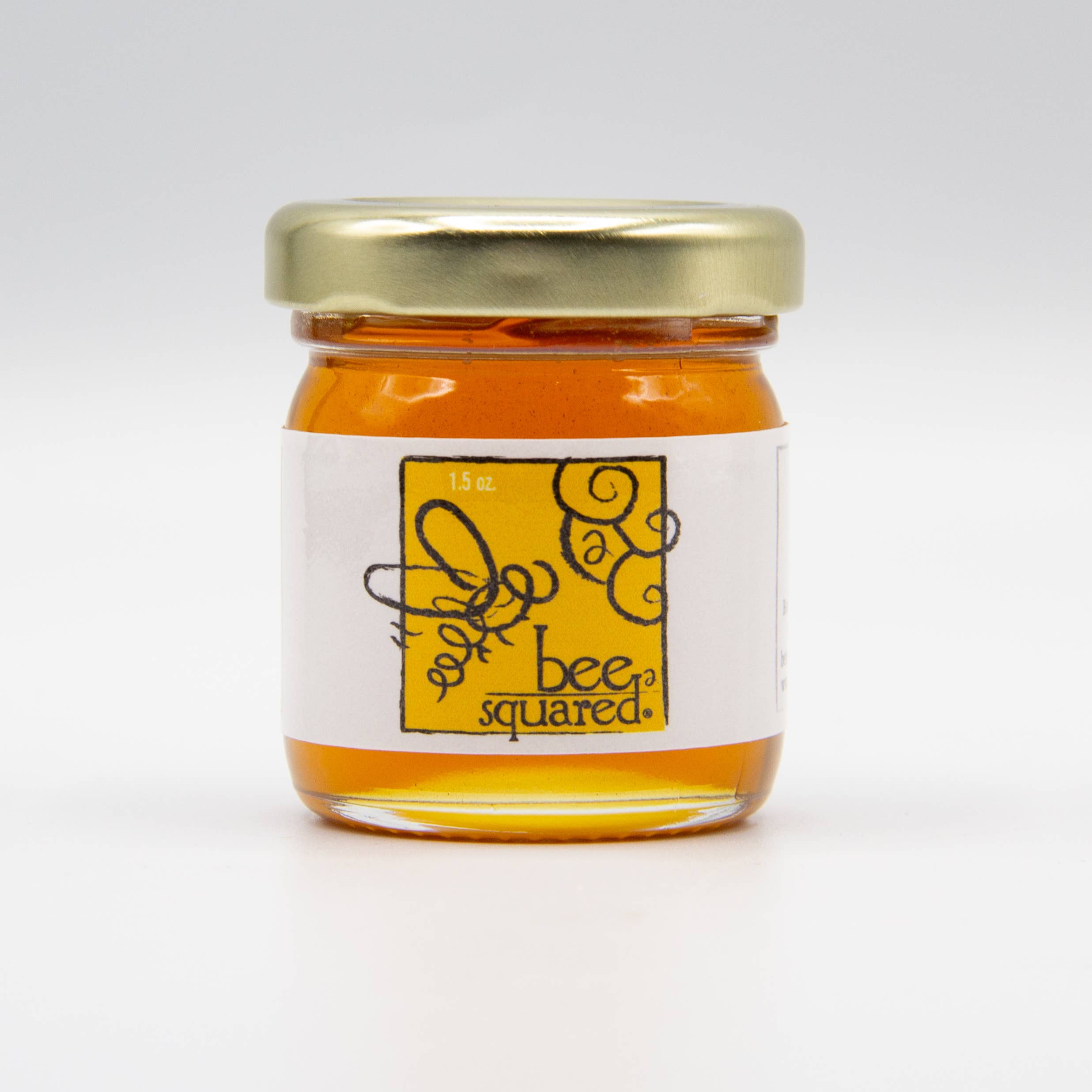 1.5 oz mini round jar of Colorado alfalfa wildflower honey