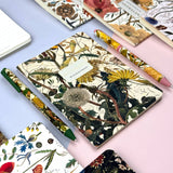 A5 ruled notebook with a green botanical cover design, interior ruled pages