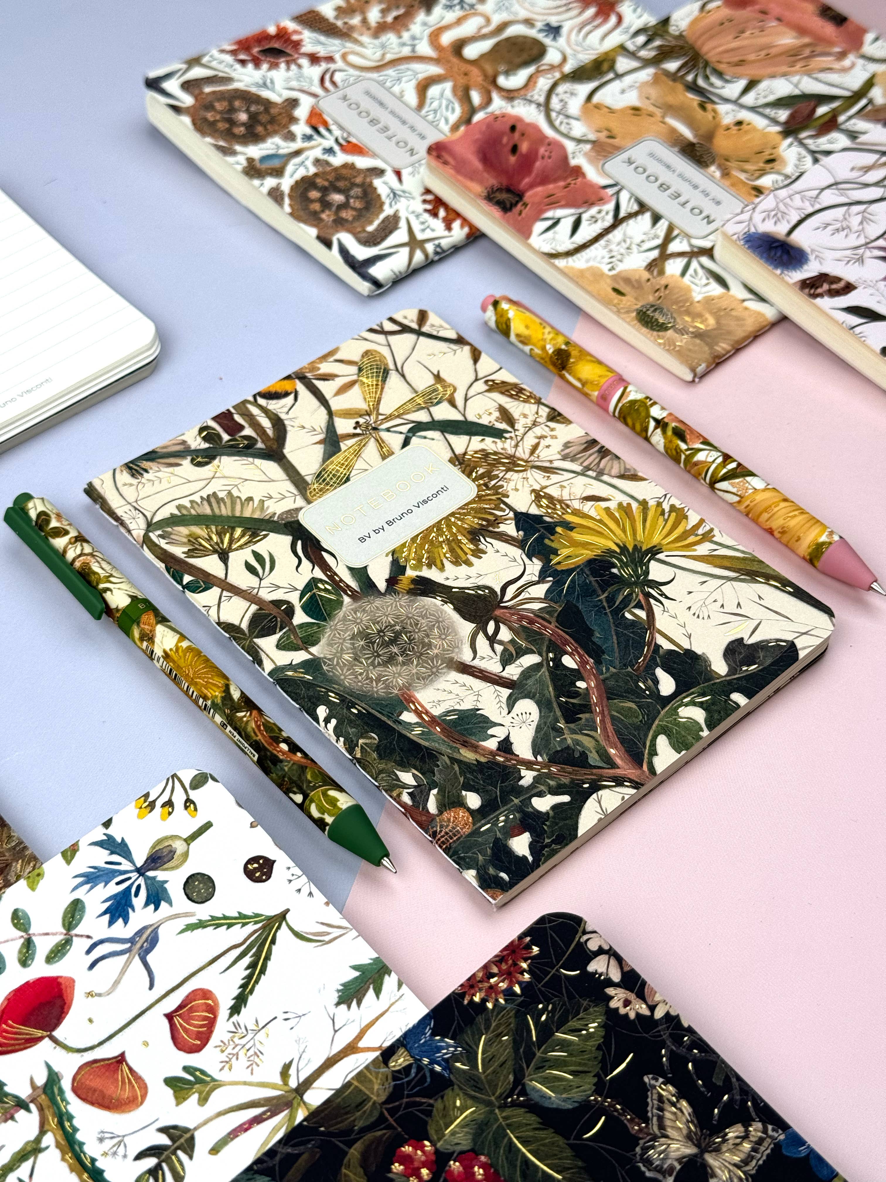 A5 ruled notebook with a green botanical cover design, interior ruled pages