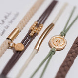 Climb hair tie bracelet set in brown, cream and green with gold mountain charm, view 3