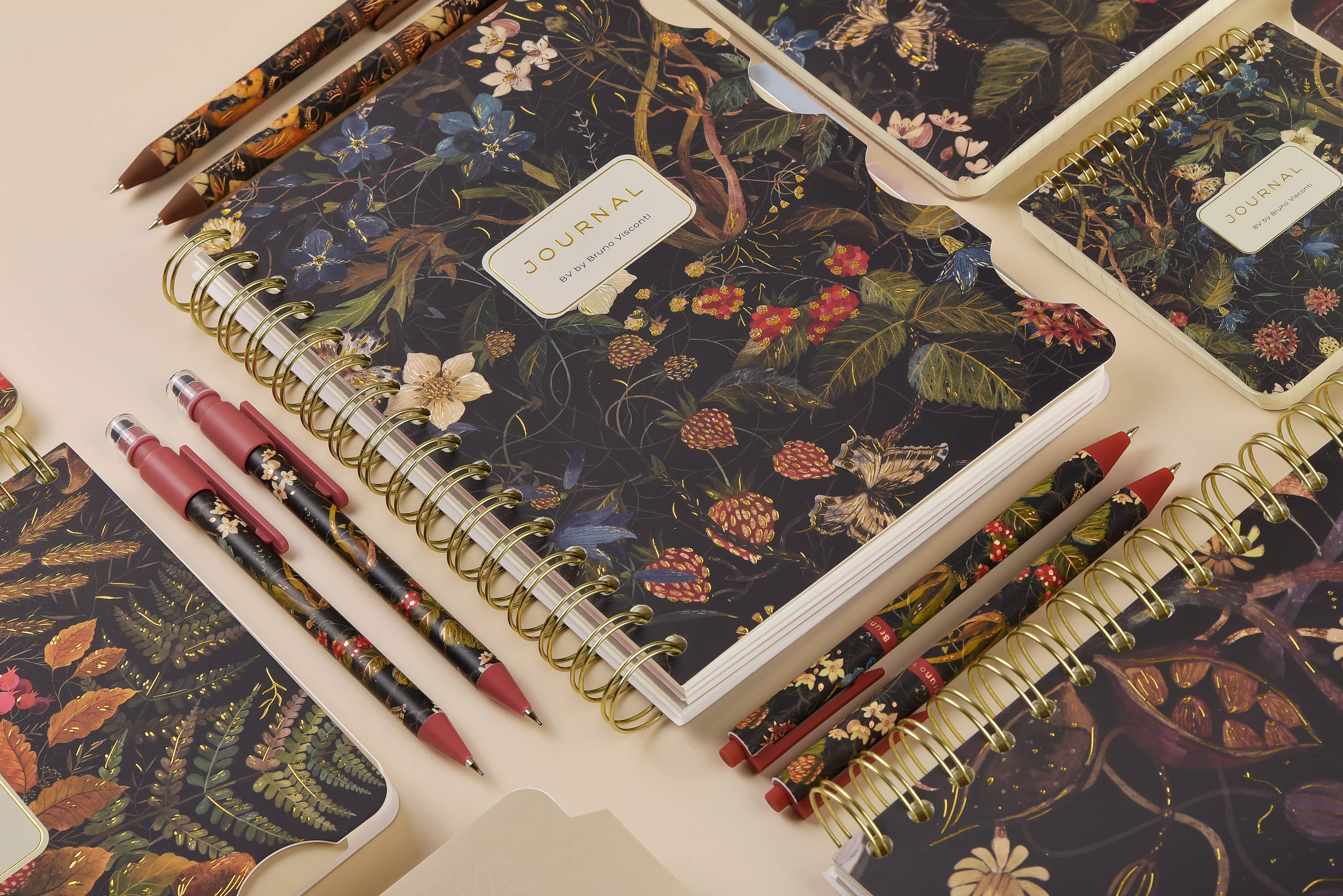 Spiral-bound art journal with a Forest Flowers illustrated cover, interior pages