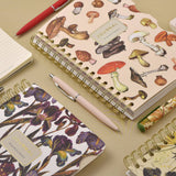 Spiral-bound art journal with a painted iris cover, interior pages