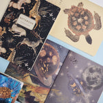 A5 ruled notebook with a galaxy and starfield cover design, interior ruled pages